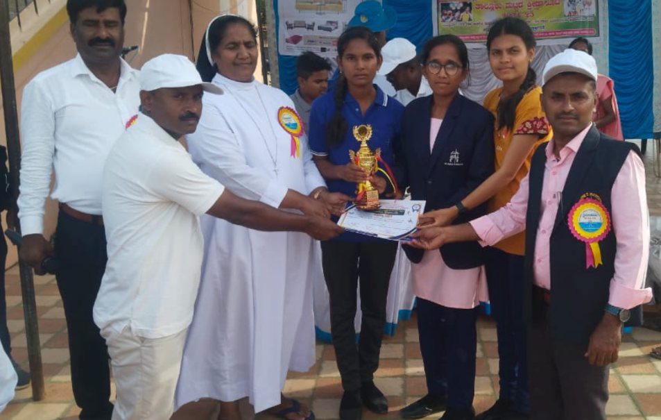 St. Anne's girls' team receiving trophy and certificate